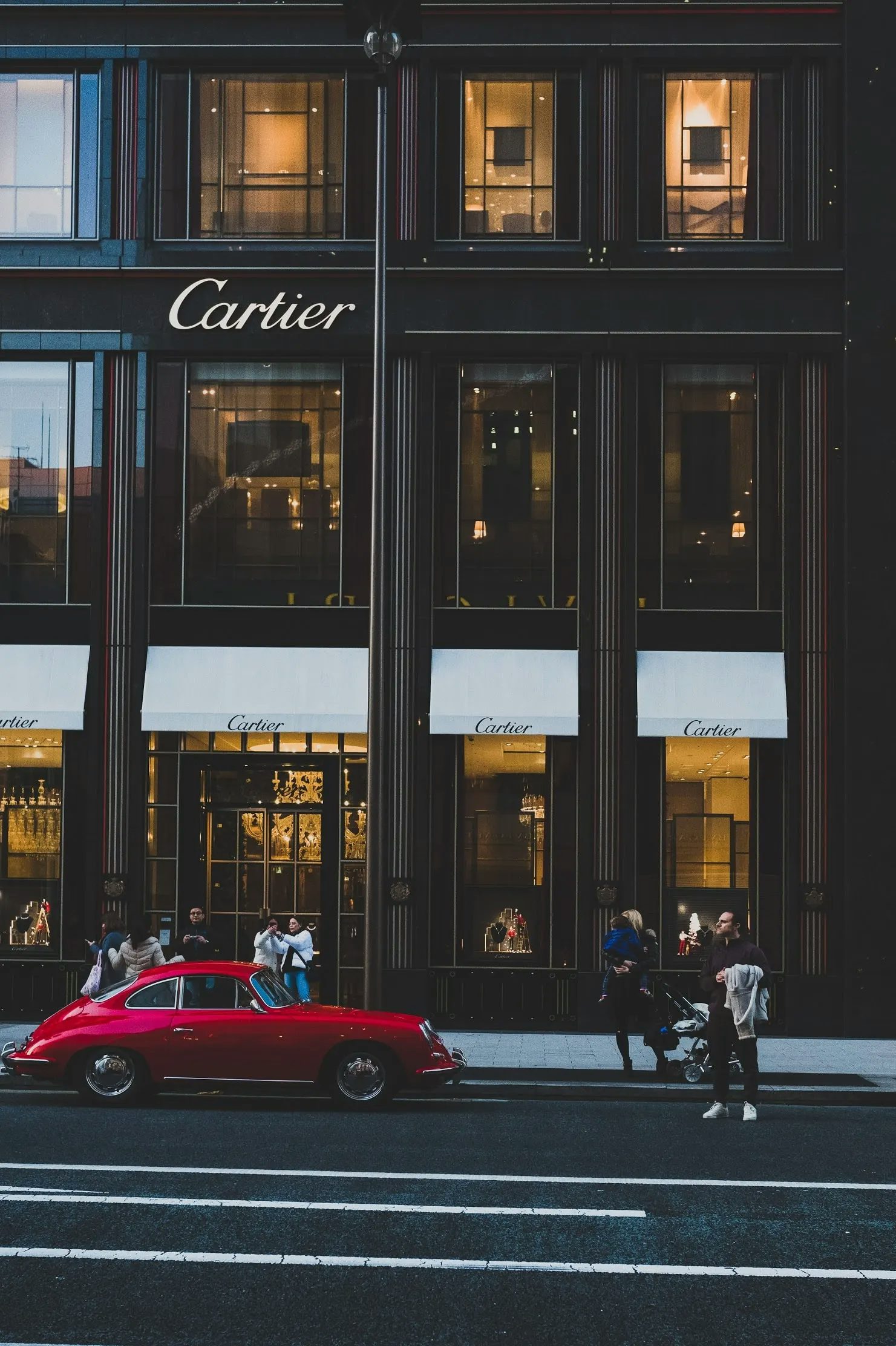 Image of car beside cartier store